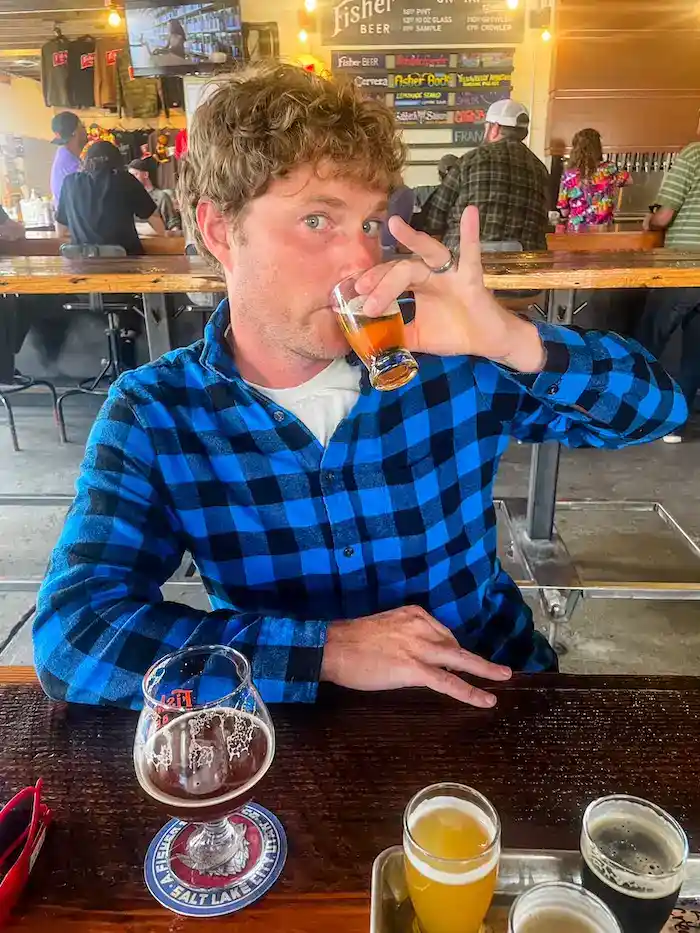 A man drinks beer tasters at a brewery in Salt Lake City.