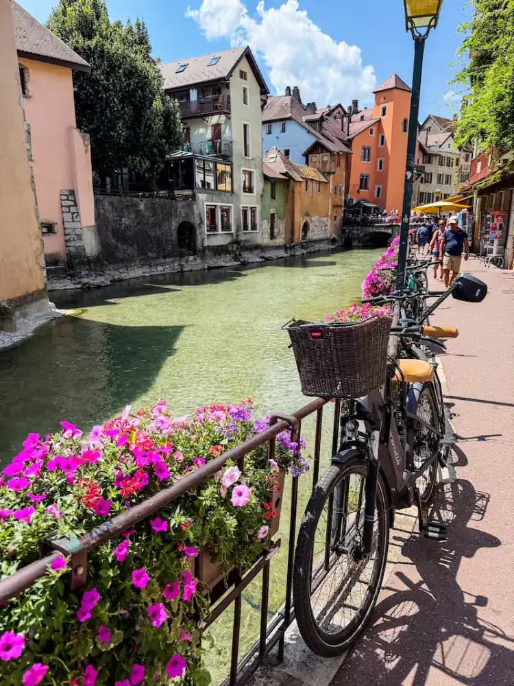A bicycle parked at a canal in Annecy