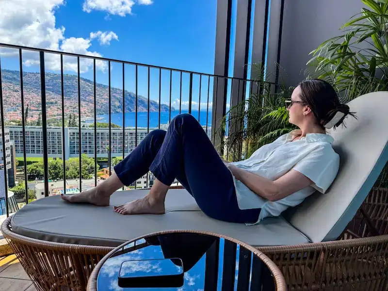A woman relaxes at her hotel in Madeira.