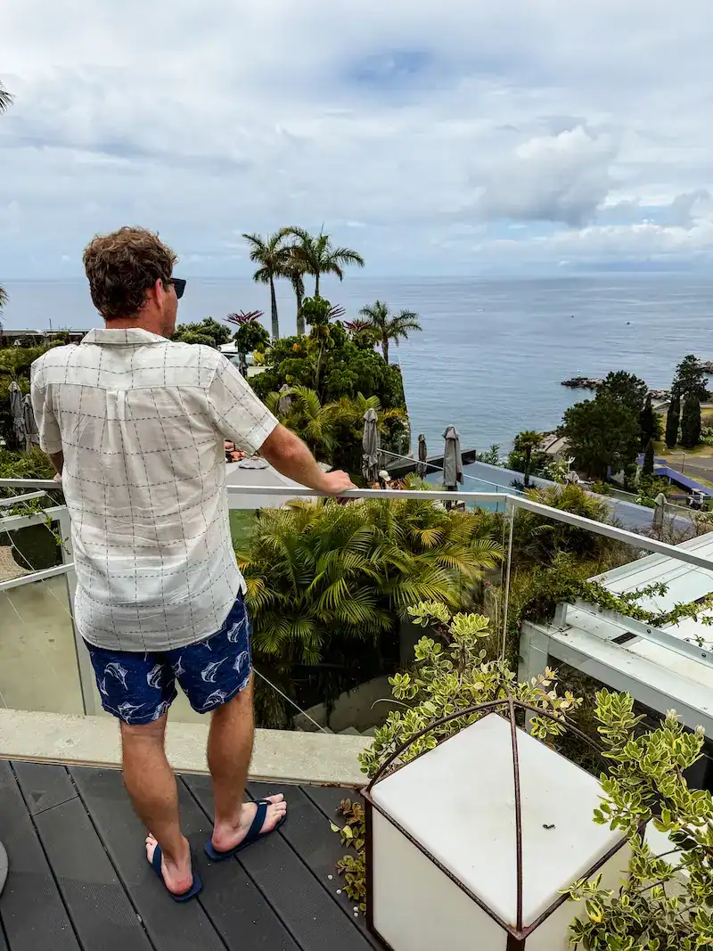A man looks out at the sea in Madeira.
