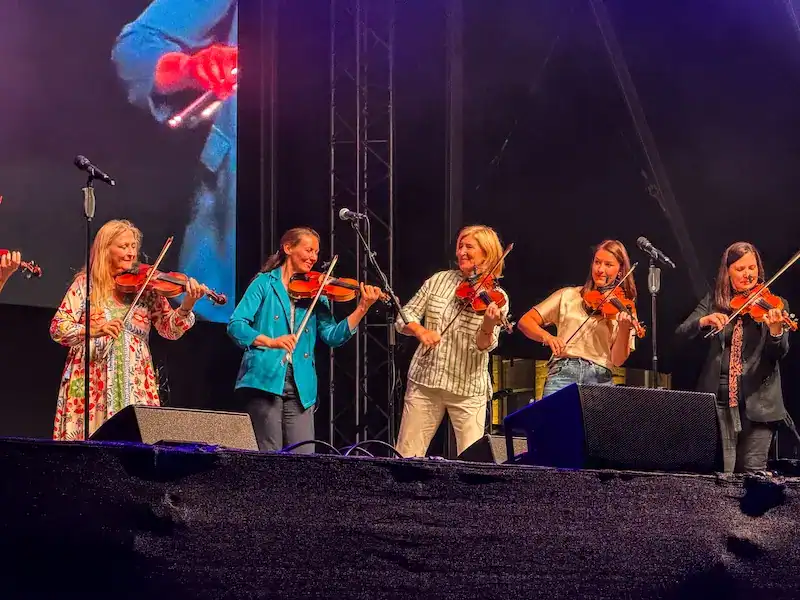 A group of fiddlers play at a show in Belfast.