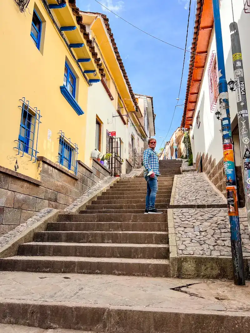 A man walks a set of steps in Cusco.