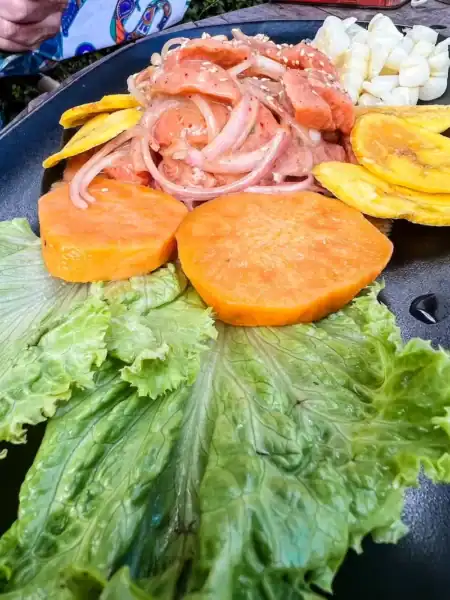 A platter of ceviche and sweet potato in Cusco