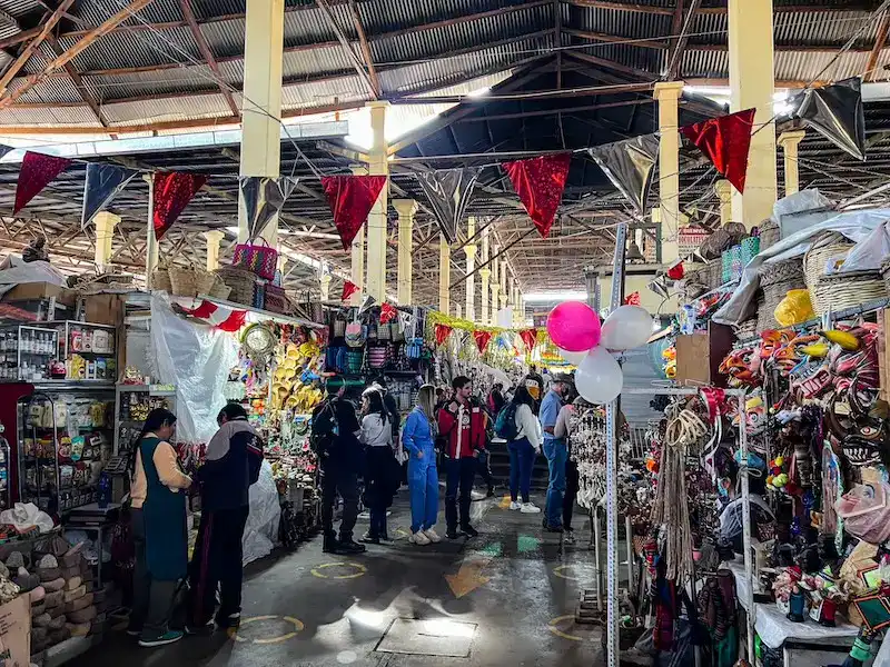 People shop at the busy Mercado Central de San Pedro in Cusco.