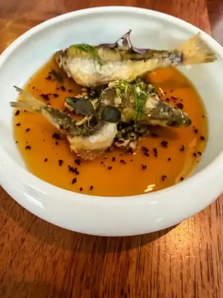 Fried fish in a broth in Lyon