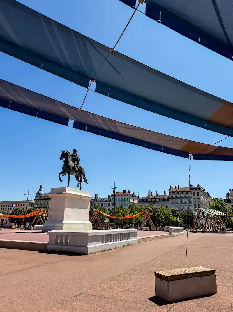A statue on the Place Bellecour on one day in Lyon