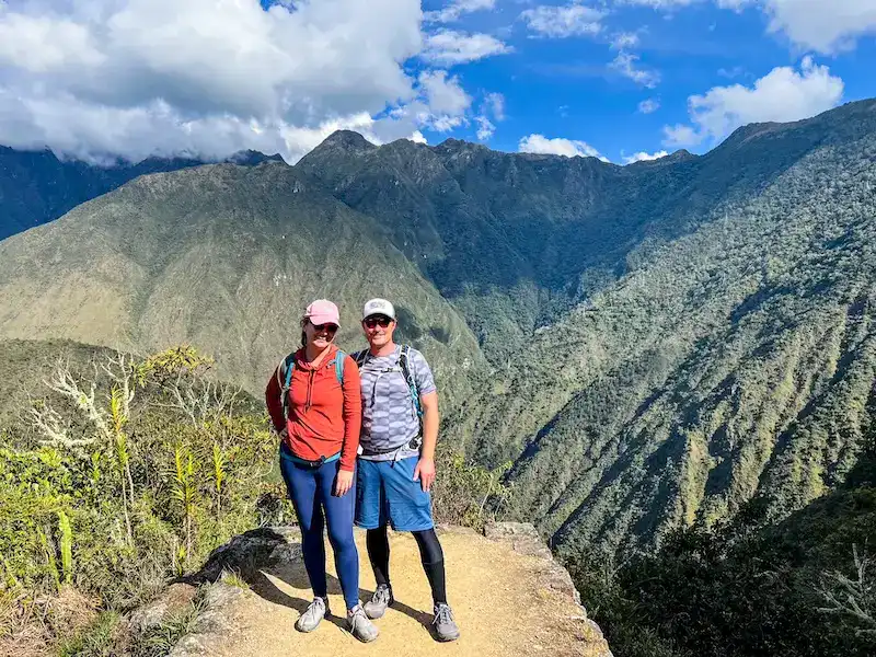 A couple poses near Machu Picchu.