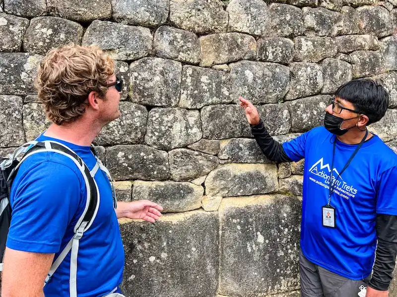 A guide on a tour at Machu Picchu