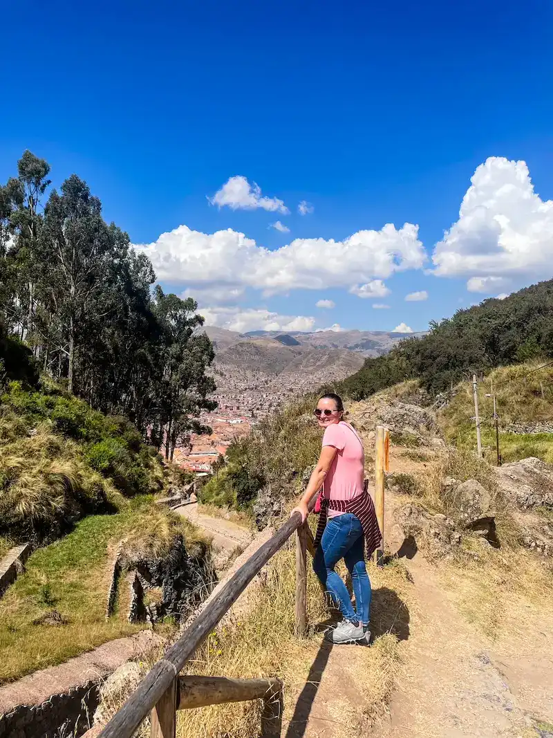 A woman poses at a vista in Cusco, Peru.