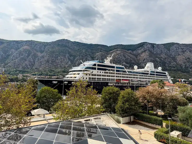 A large cruise ship arrives in the Balkans.