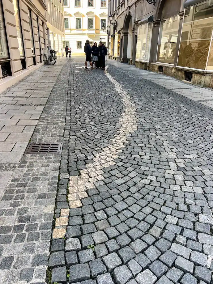 Bronze stones lining Viscardigasse in Munich