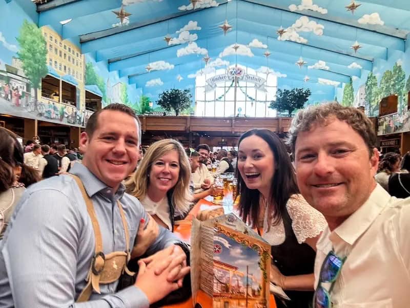 Friends cheers glasses at Oktoberfest in Munich.