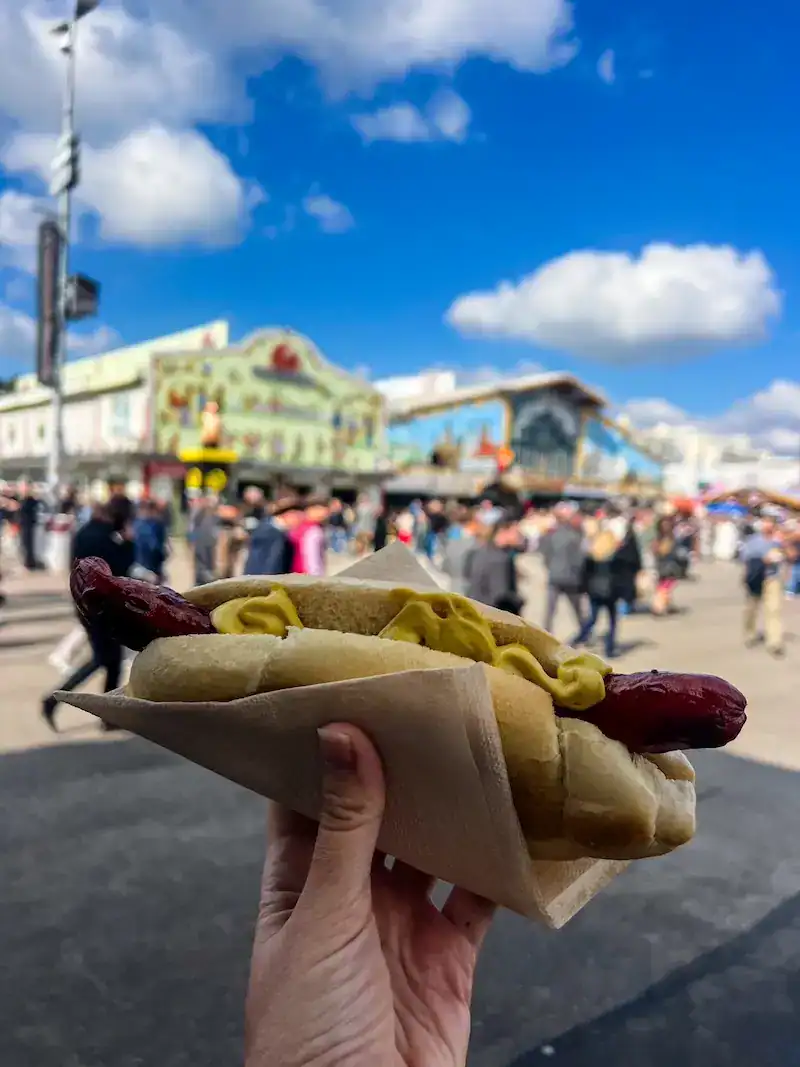 Holding a hot dog at Oktoberfest in Munich