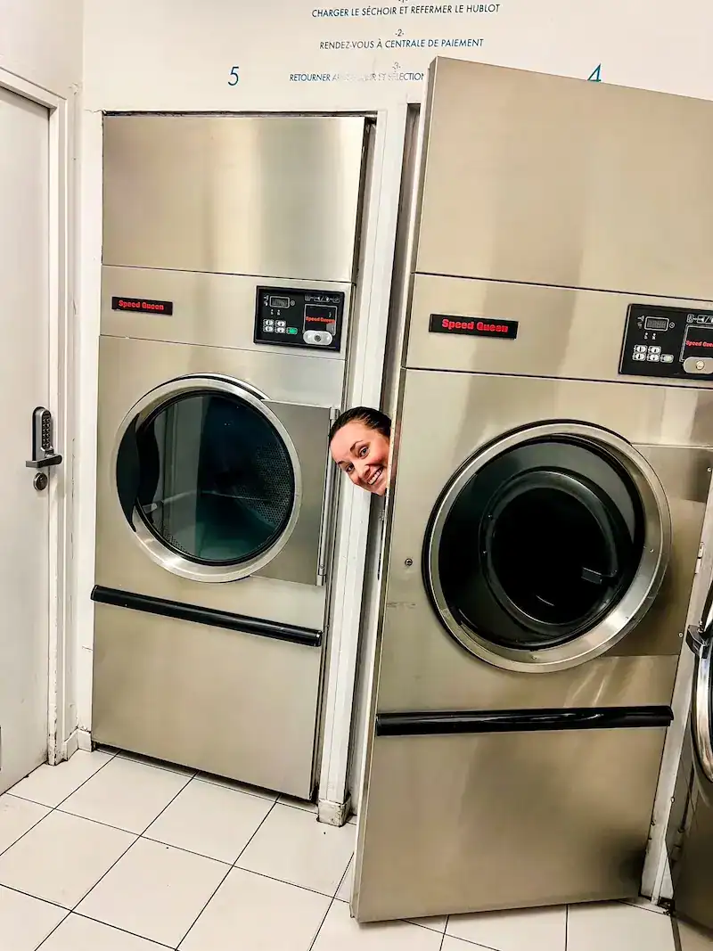A woman enters a cocktail bar through a laundry machine in the 10th, considered by some to be the worst arrondissement in Paris.