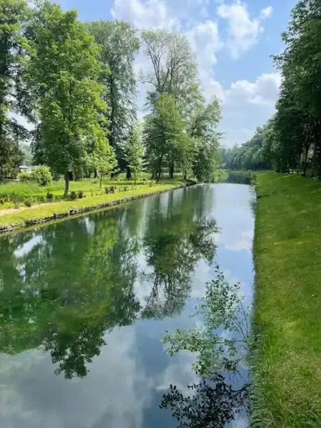A river running through the grounds at Château de Chantilly, an easy day trip from Paris