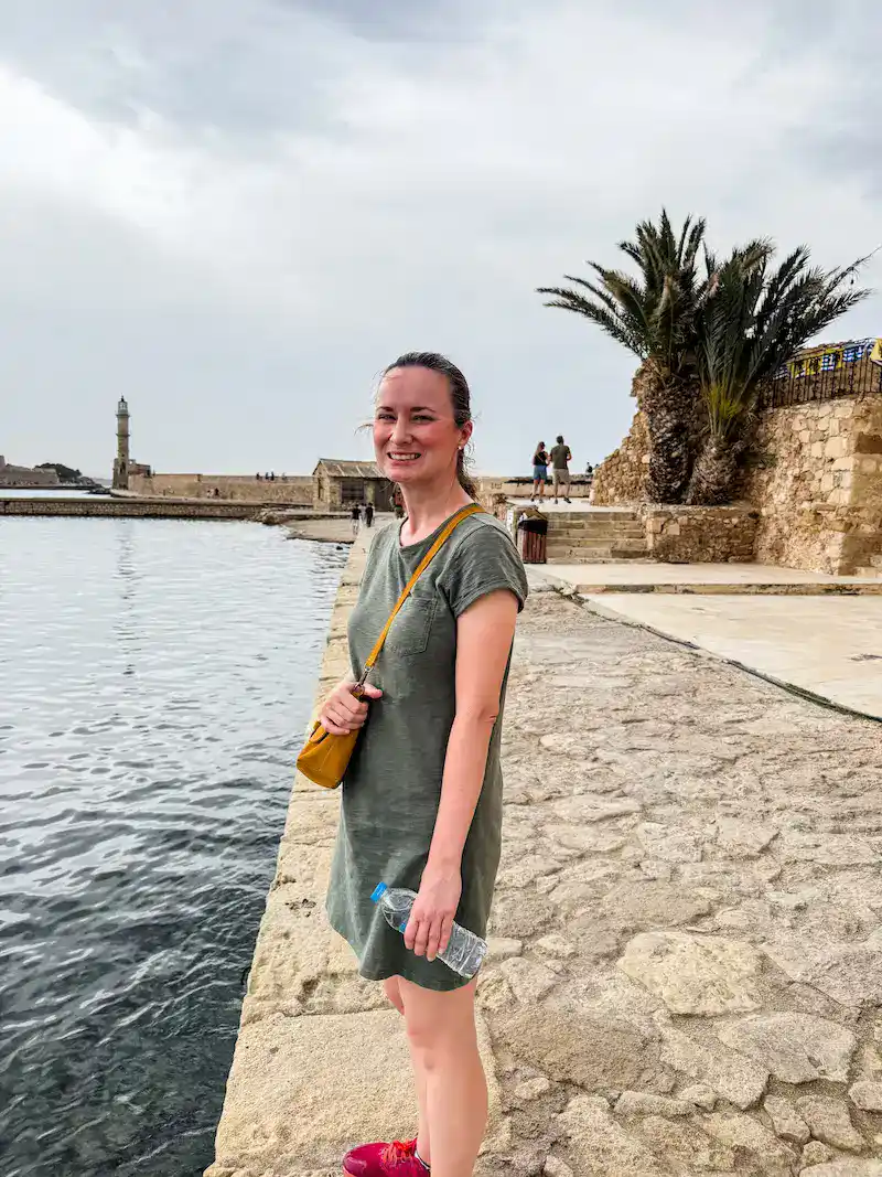 A woman poses on a hot day on a Crete itinerary.