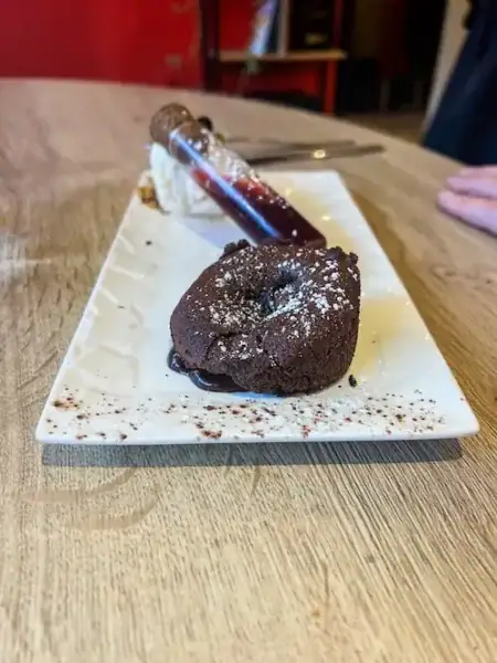 A chocolate dessert with raspberry sauce in Normandy