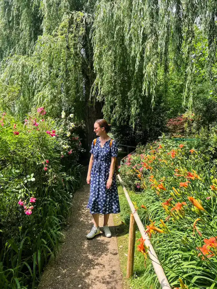 A woman in the gardens of Giverny on a day trip from Paris