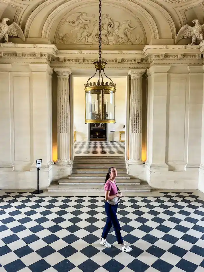 A woman poses inside Maisons-Laffitte, a day trip from Paris.