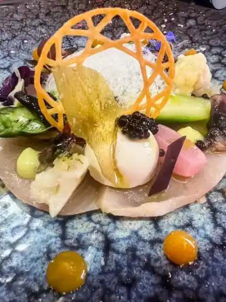 An elaborate meal at Le Village Tomohiro on a day trip from Paris